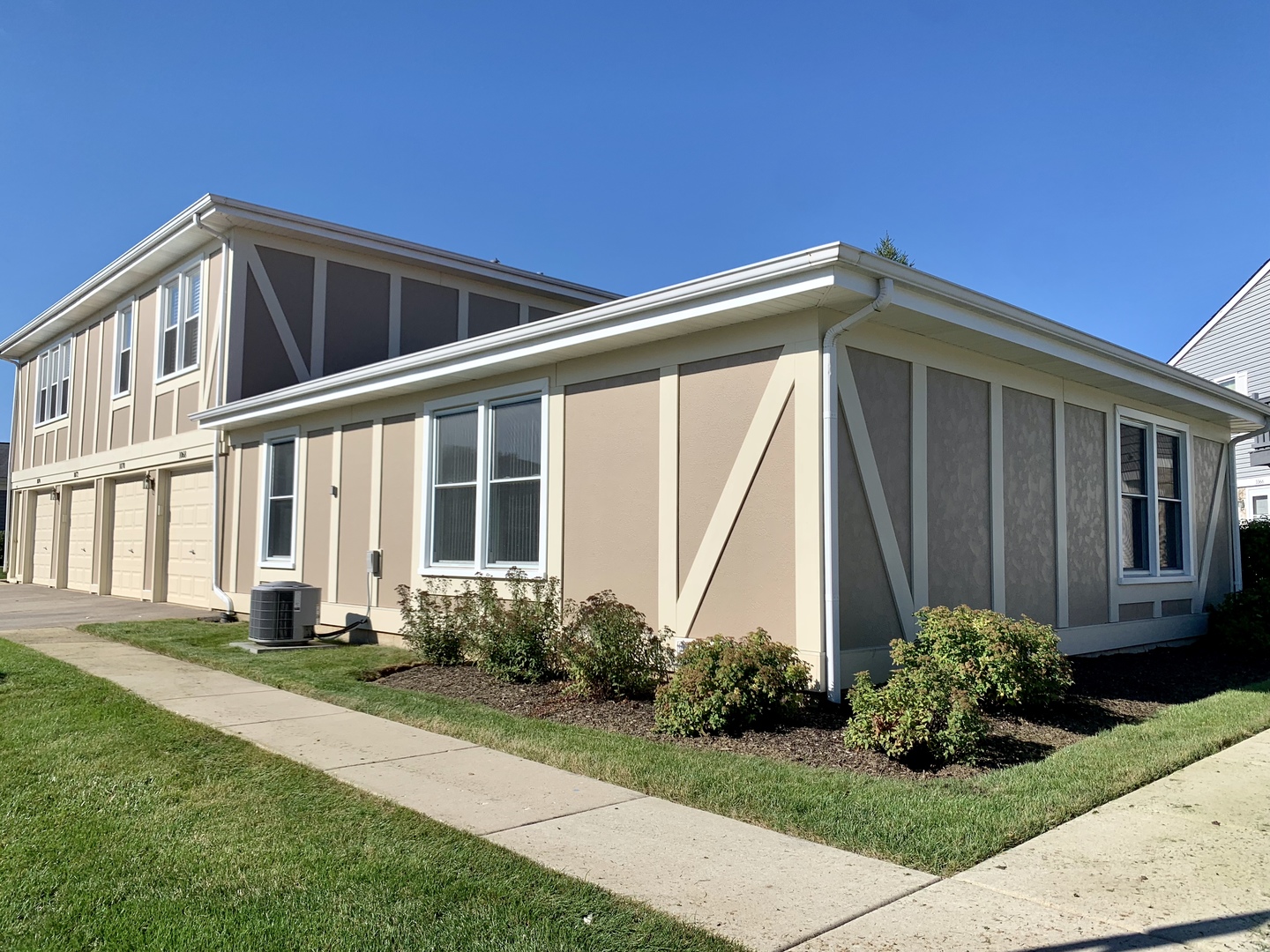 1068 Glouchester Harbor, Unit 1068 Schaumburg, IL 60193 - Photo 2 of 26 a front view of a house with garden
