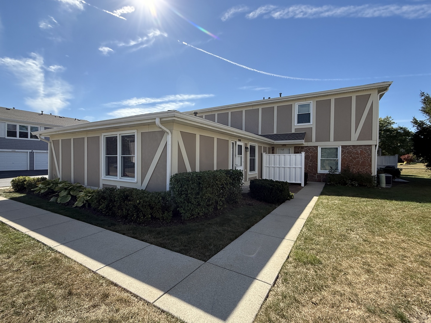 1068 Glouchester Harbor, Unit 1068 Schaumburg, IL 60193 - Photo 24 of 26 a front view of a house with garden