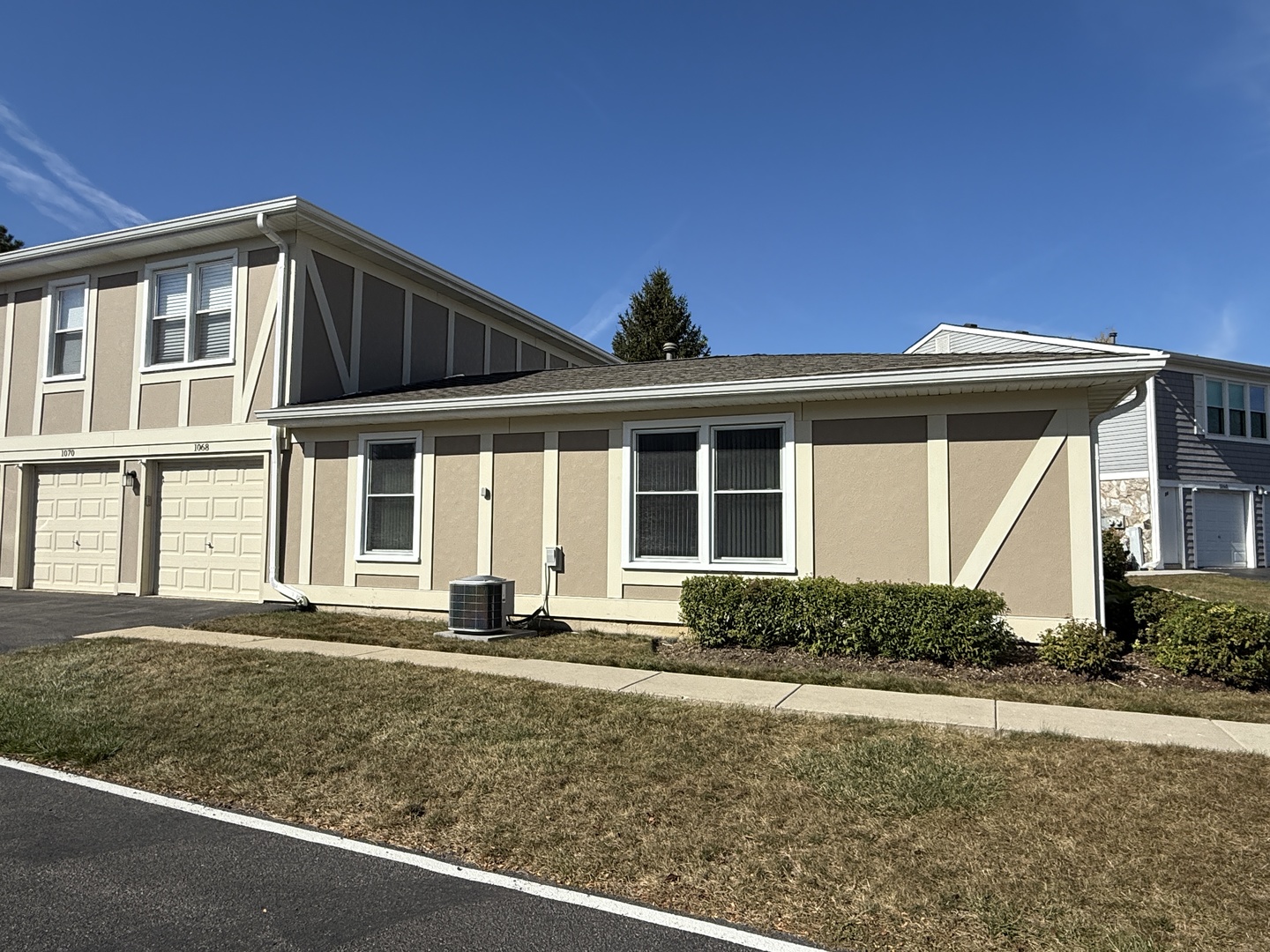 1068 Glouchester Harbor, Unit 1068 Schaumburg, IL 60193 - Photo 25 of 26 a front view of a house with garden