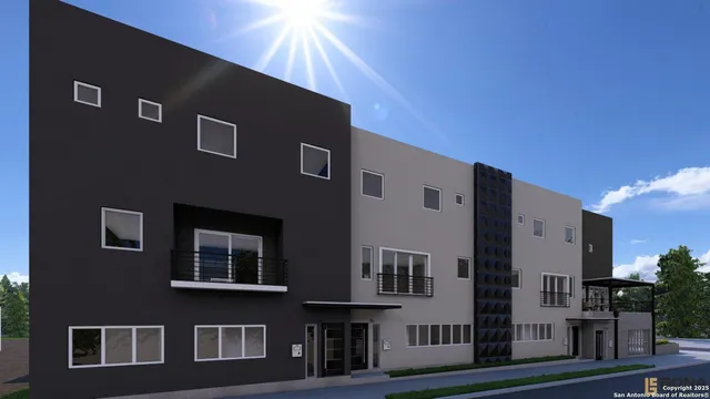 a front view of a building with many windows