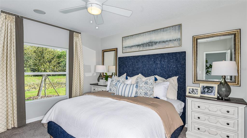 13709 Shellmore Avenue Palmetto, FL 34221 - Photo 13 of 17 a bedroom with a bed and a window