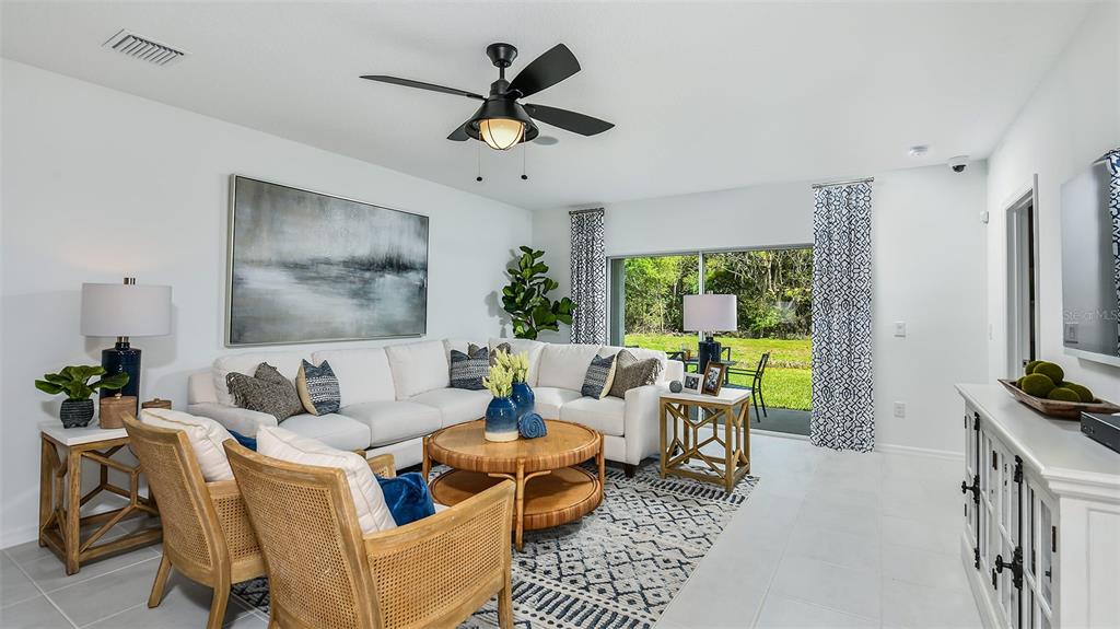 13709 Shellmore Avenue Palmetto, FL 34221 - Photo 10 of 17 a living room with furniture and a large window