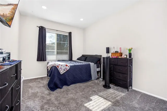 a bed room with a bed and a window