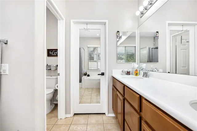 a view of bathroom with dual sinks