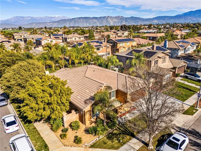 an aerial view of a swimming pool with outdoor seating