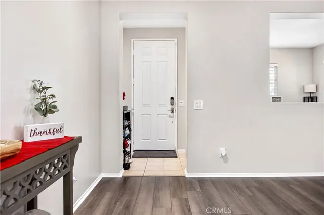 a view of an entryway with wooden floor