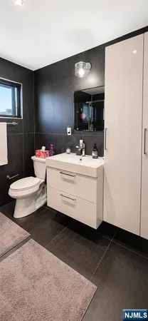 a bathroom with a sink double vanity and a mirror