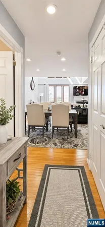 a view of kitchen with kitchen island granite countertop a stove and a sink