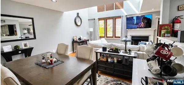 a living room with furniture fireplace and window