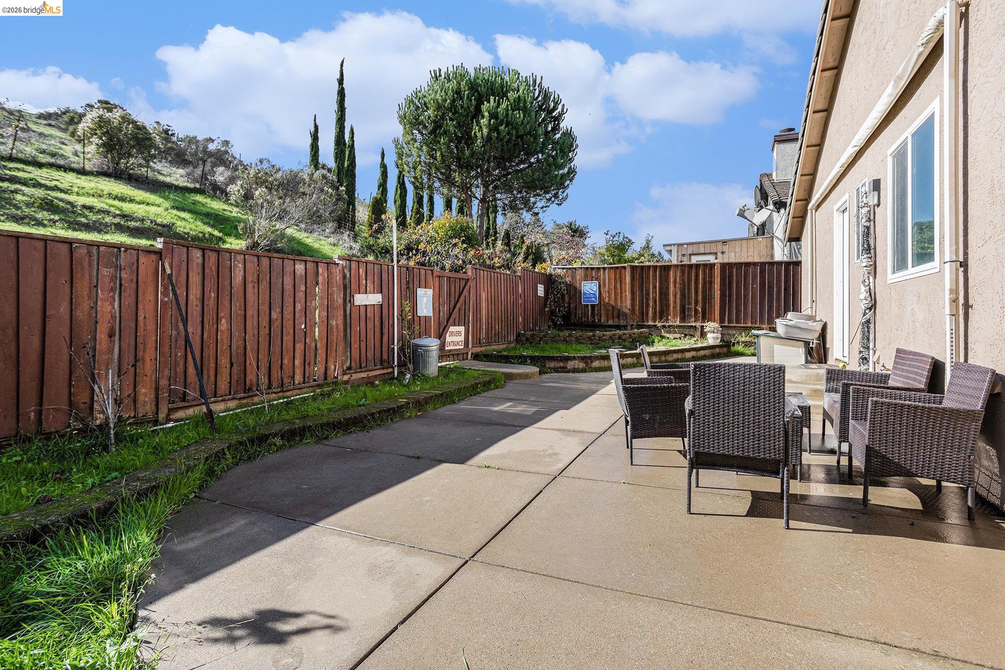 5490 Lenora Road Richmond, CA 94803 - Photo 20 of 22 a view of a patio with couches table and chairs and potted plants
