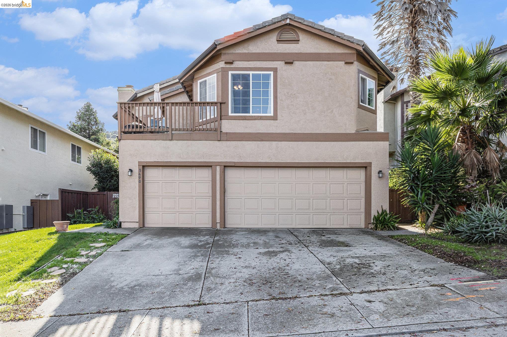 5490 Lenora Road Richmond, CA 94803 - Photo 2 of 22 a front view of a house with a yard and garage