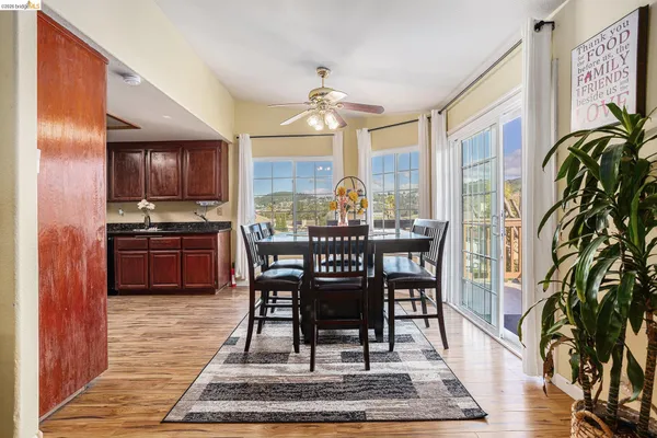a view of a dining room with furniture window and wooden floor