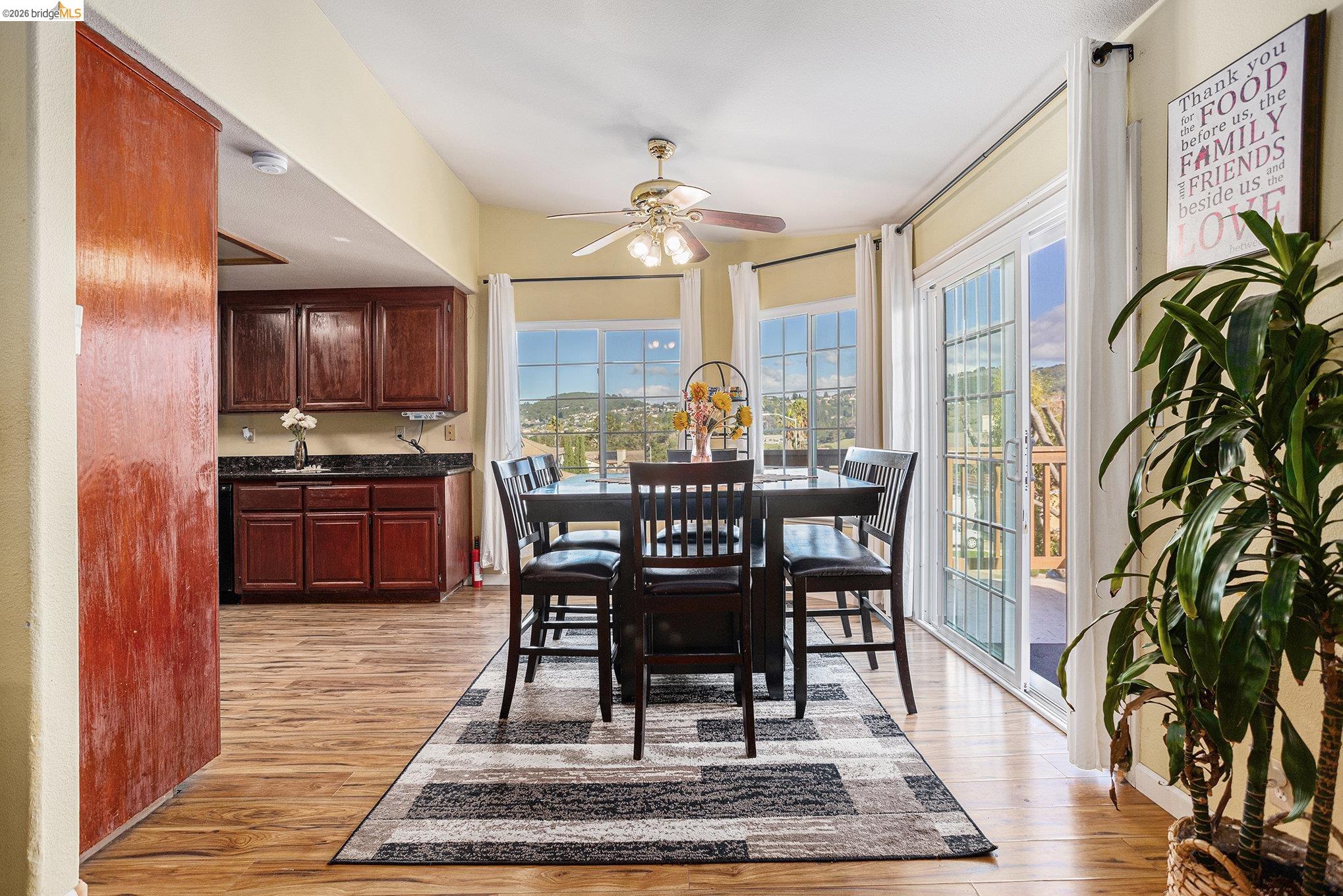 5490 Lenora Road Richmond, CA 94803 - Photo 7 of 22 a view of a dining room with furniture window and wooden floor
