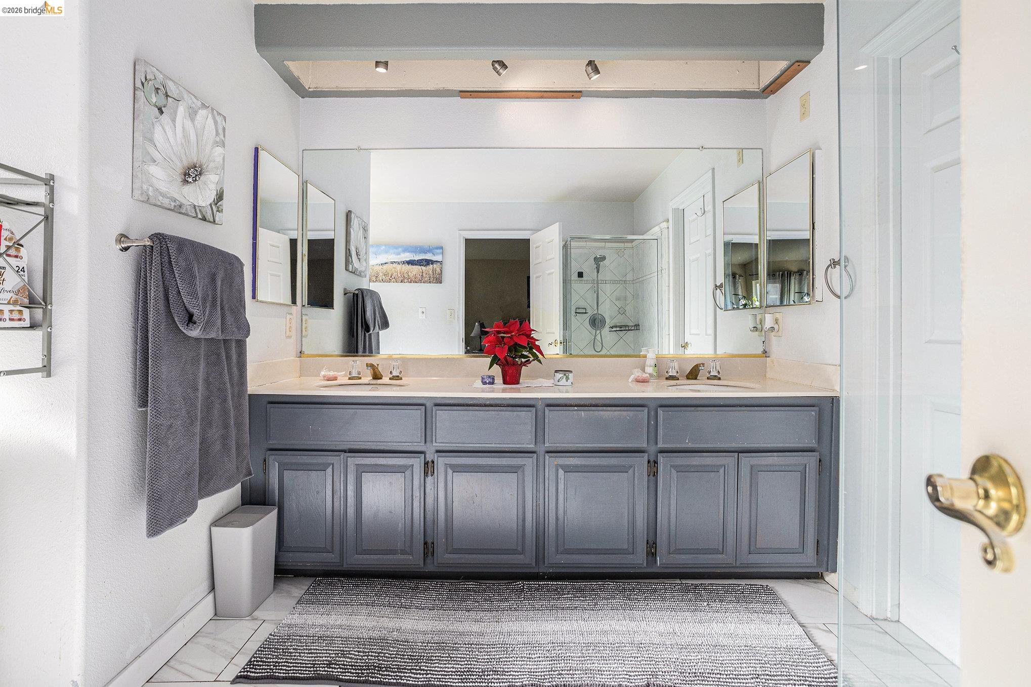 5490 Lenora Road Richmond, CA 94803 - Photo 10 of 22 a spacious bathroom with a double vanity sink and a mirror