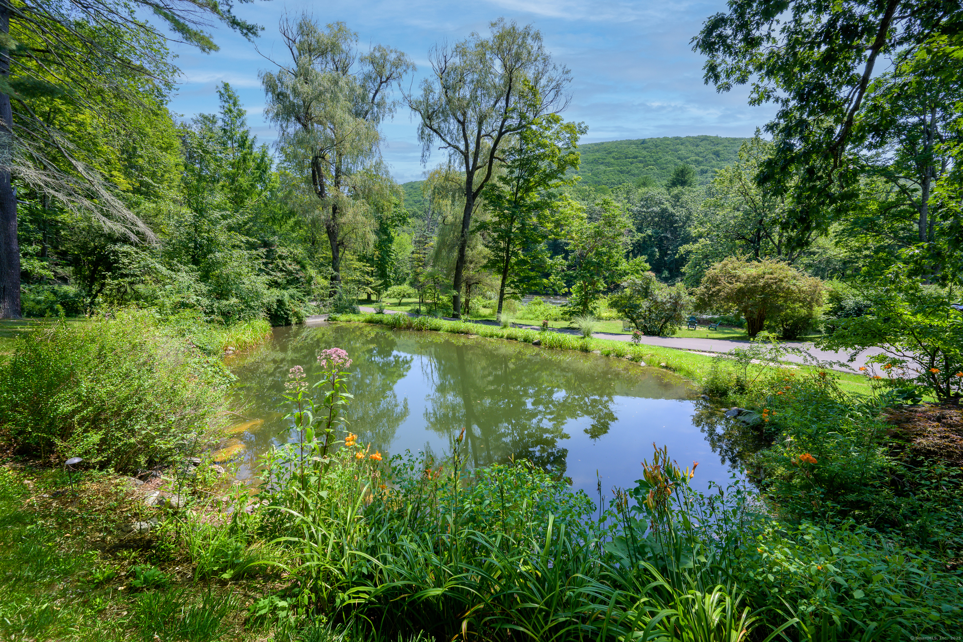 35 Kirk Road Sharon, CT 06796 - Photo 8 of 40 a view of a lake with a house