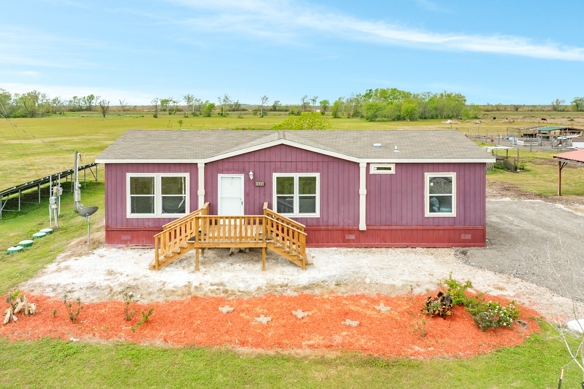 1886 County Road 212 Angleton, TX 77515 - Photo 5 of 36 a view of house with outdoor space and swimming pool