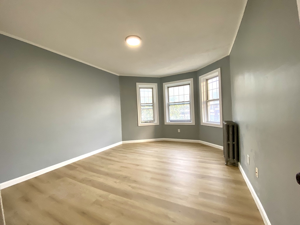 31 Queensberry Street, Unit 19 Boston, MA 02215 - Photo 5 of 6 a view of an empty room with a window