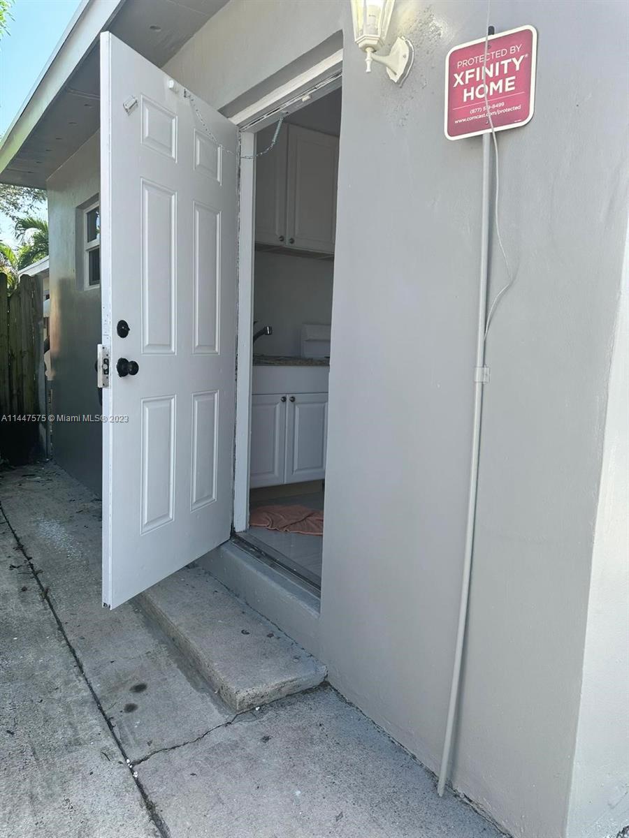 226 Southwest 11th Street, Unit 1 Dania Beach, FL 33004 - Photo 6 of 10 a view of a hallway with elevator