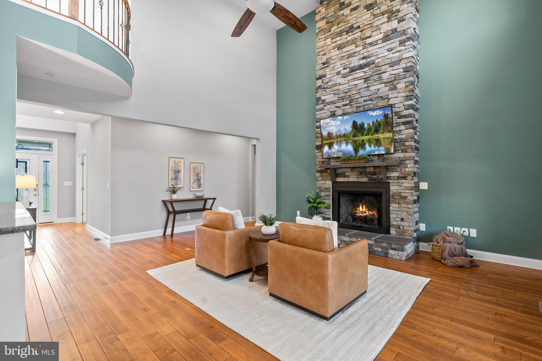 4950 Mackall Road St. Leonard, MD 20685 - Photo 54 of 97 a living room with furniture and a fireplace