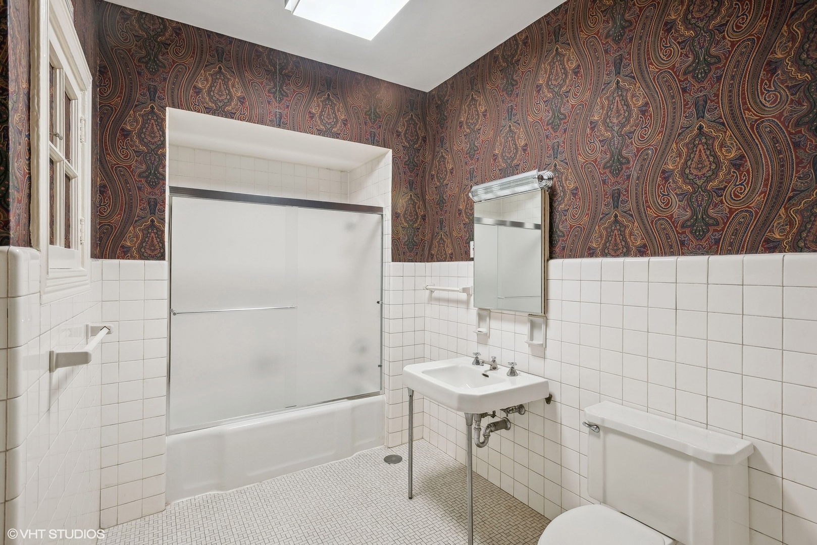 43 East Elm Street Chicago, IL 60611 - Photo 12 of 17 a bathroom with a sink a toilet and shower