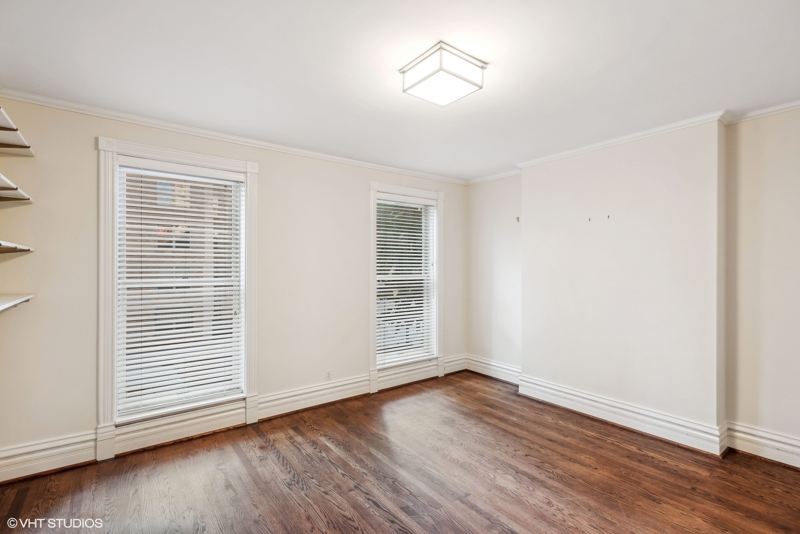 43 East Elm Street Chicago, IL 60611 - Photo 13 of 17 a view of empty room with wooden floor and fan