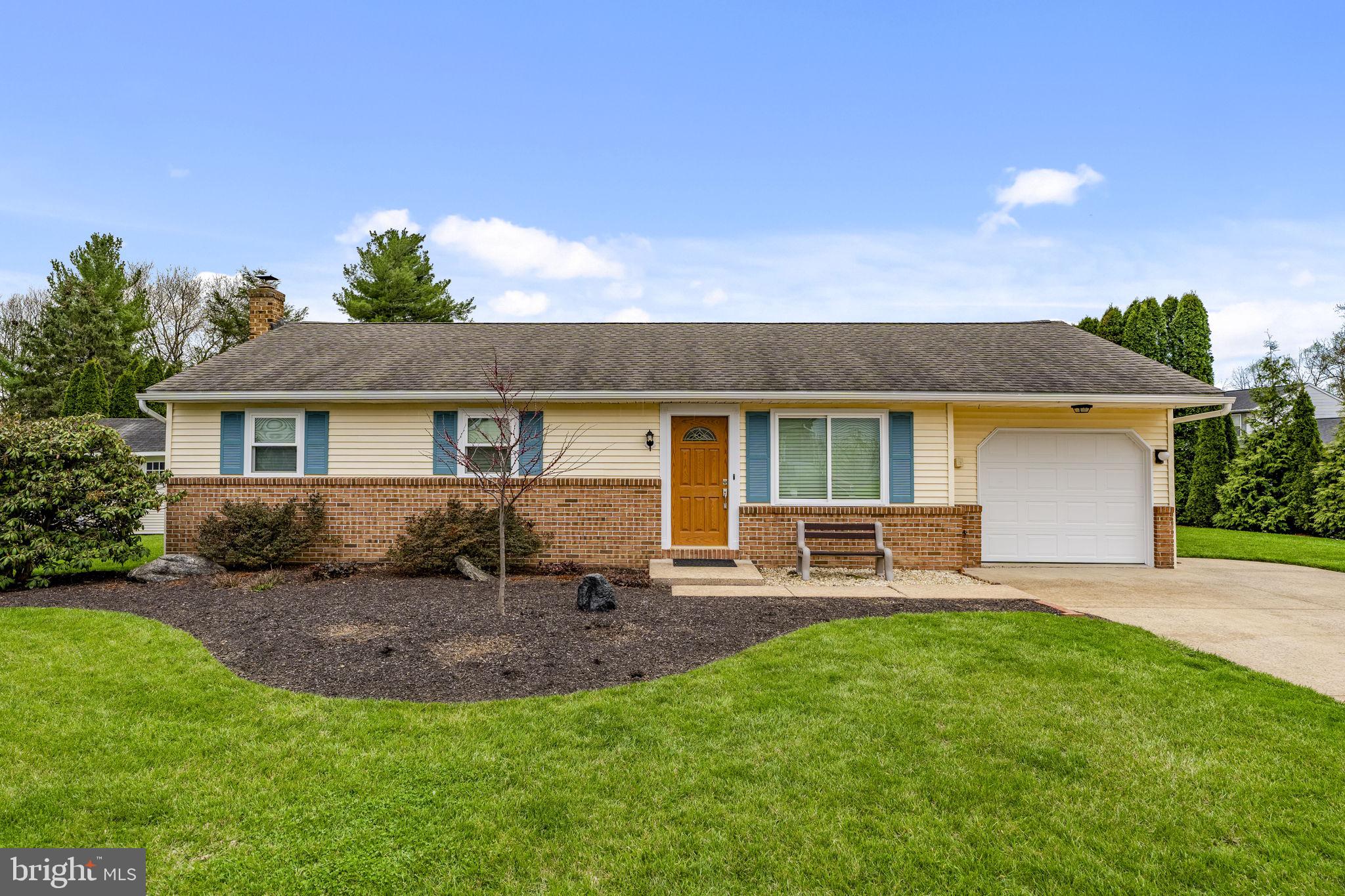 305 Partridge Drive Lititz, PA 17543 - Photo 1 of 46 a front view of a house with a garden and patio