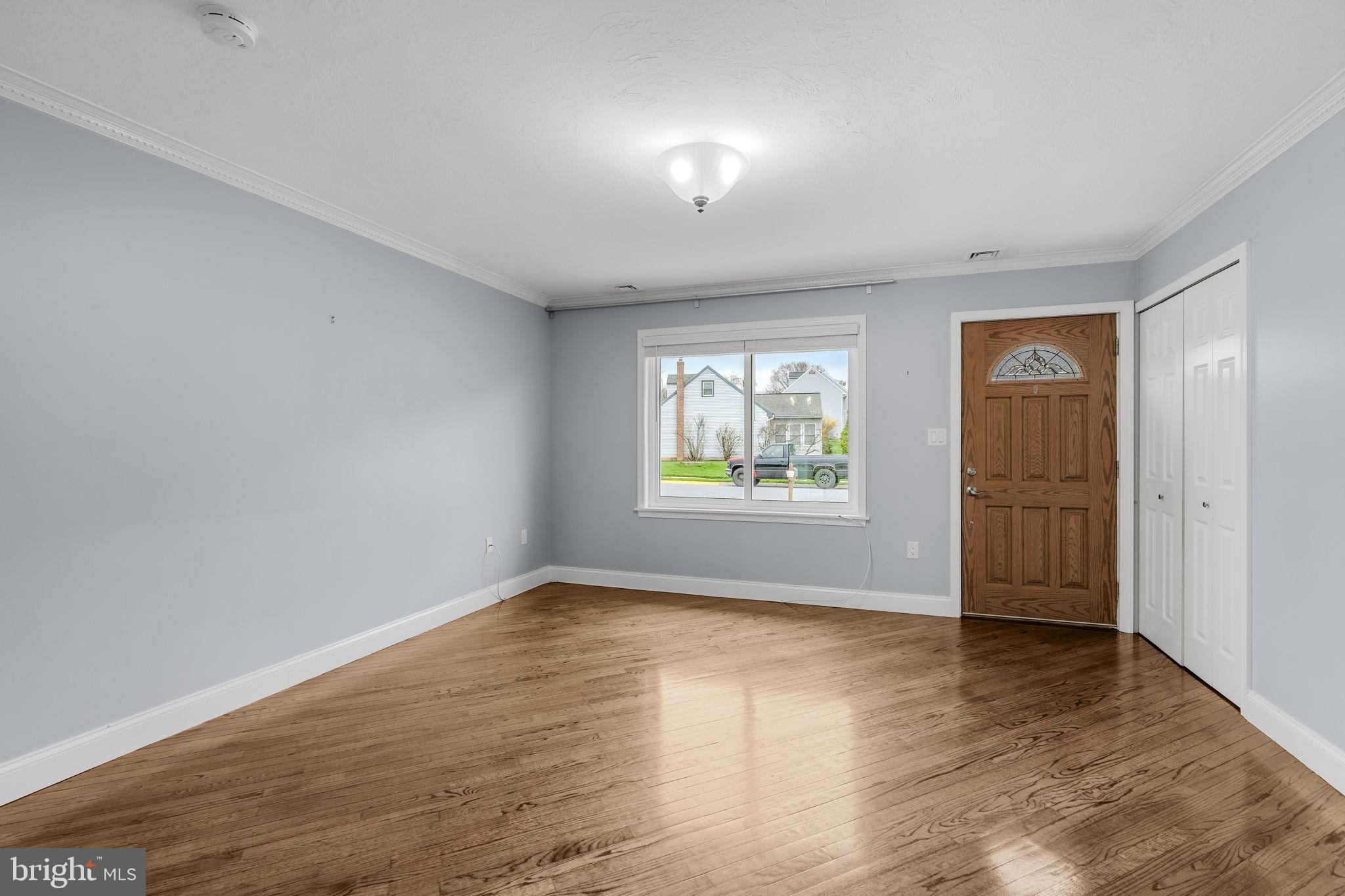 305 Partridge Drive Lititz, PA 17543 - Photo 3 of 46 an empty room with wooden floor and windows