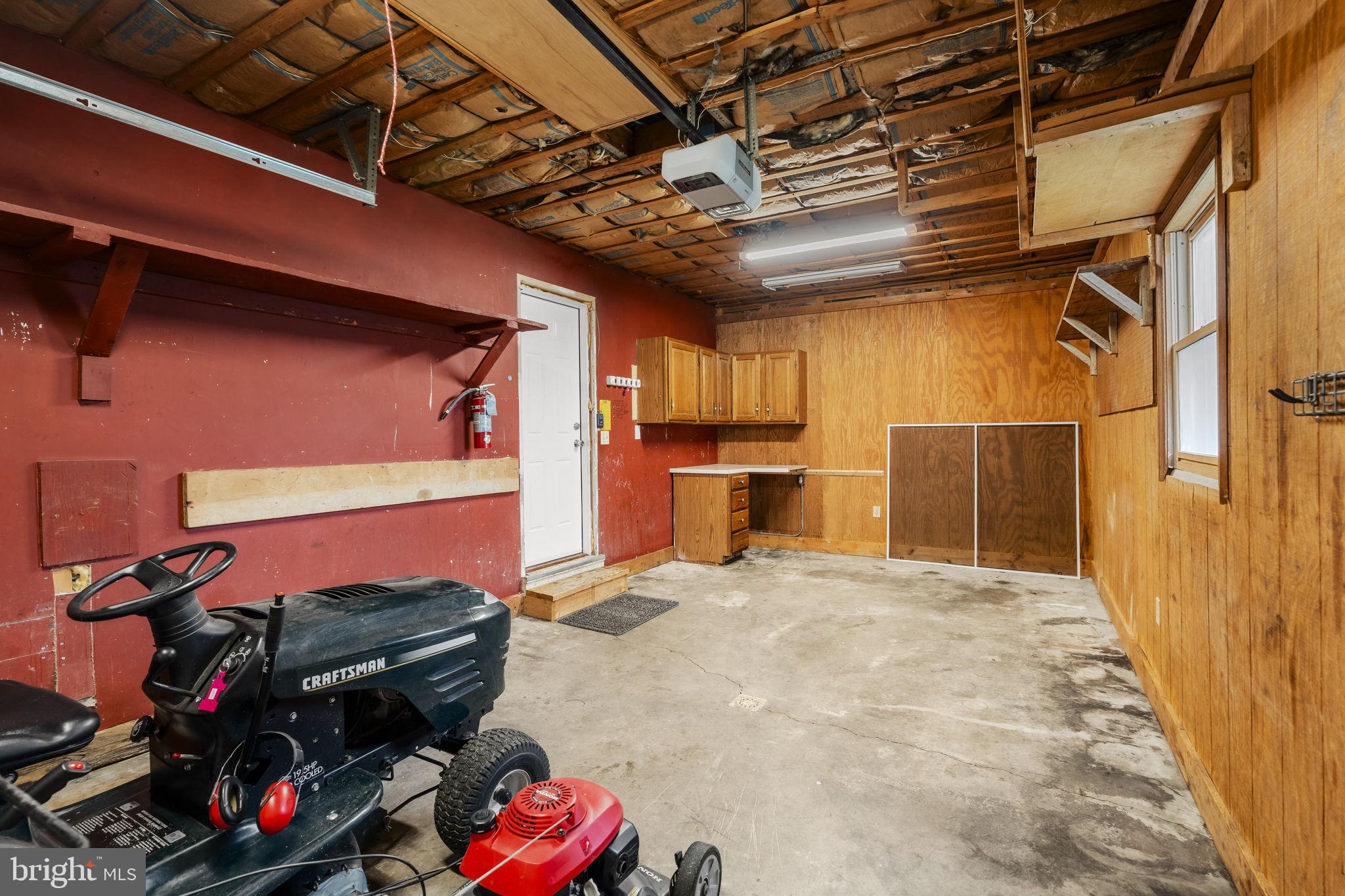 305 Partridge Drive Lititz, PA 17543 - Photo 33 of 46 a view of a storage room with refrigerator and washer