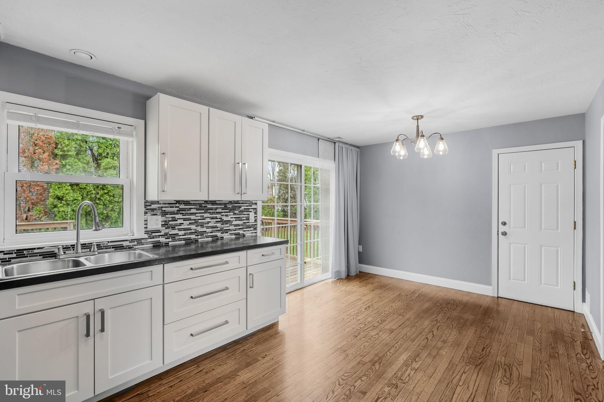 305 Partridge Drive Lititz, PA 17543 - Photo 8 of 46 a view of a kitchen with wooden floor cabinets and windows