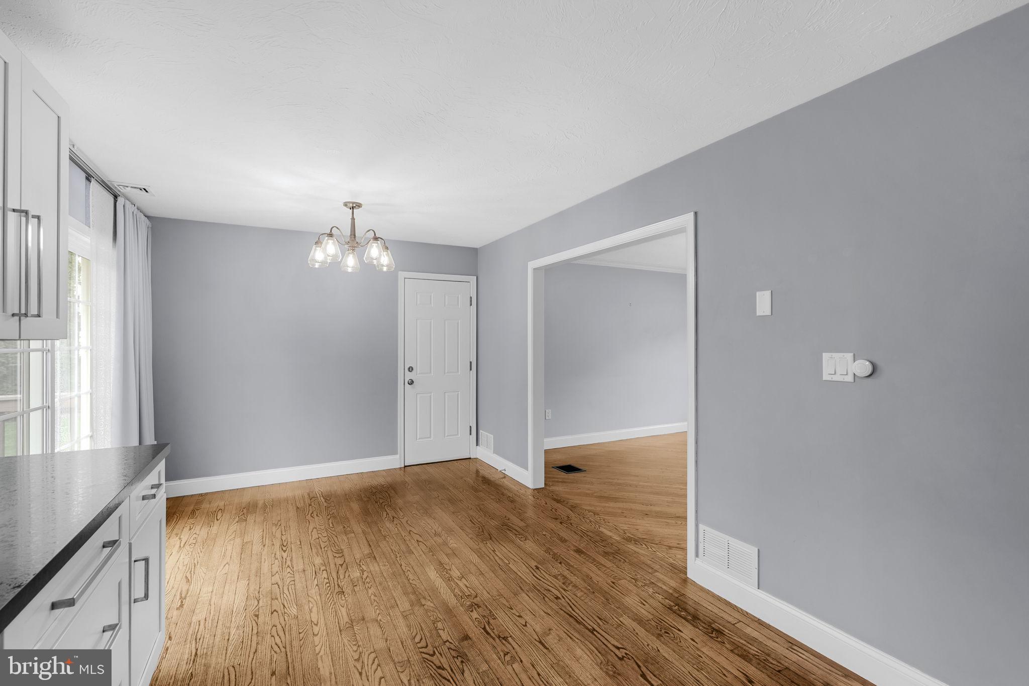 305 Partridge Drive Lititz, PA 17543 - Photo 9 of 46 wooden floor in an empty room with a window