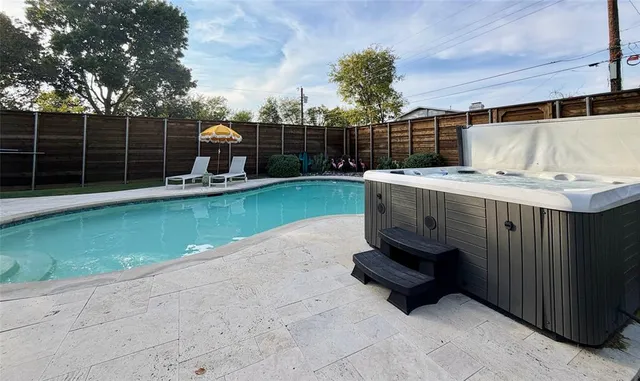 a view of a backyard with sitting area and furniture