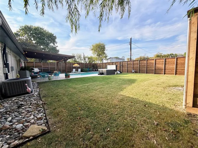 a view of a backyard with a patio
