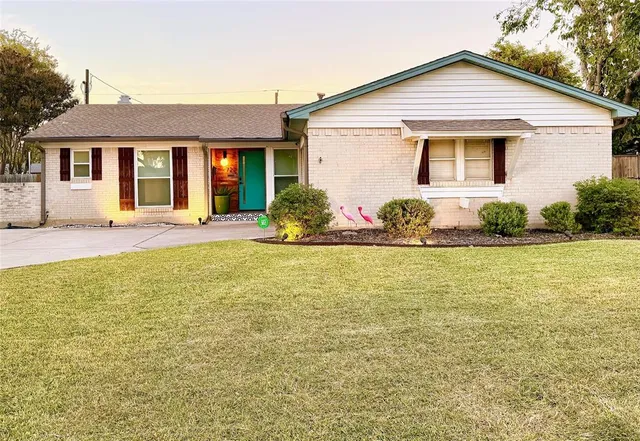 a front view of house with yard and seating area