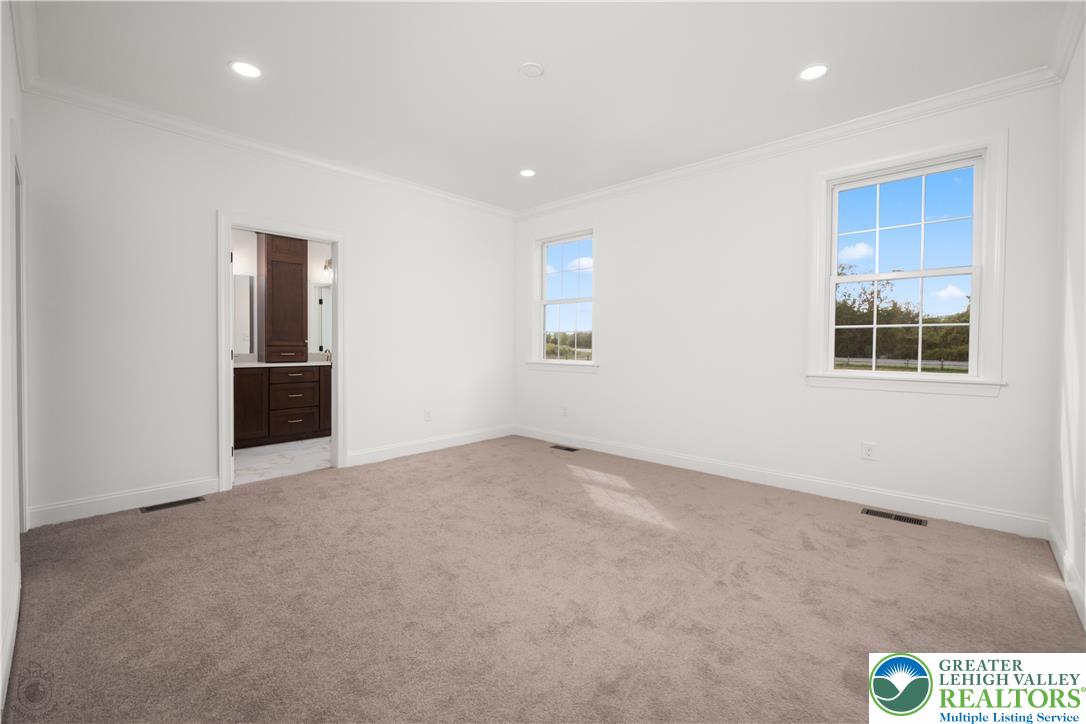 4268 Stonebridge Drive Bethlehem, PA 18015 - Photo 22 of 37 an empty room with windows and closet