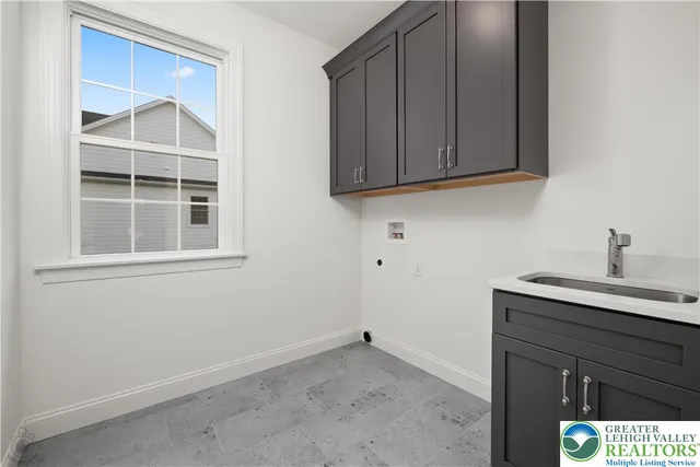 a kitchen with a sink and a cabinets