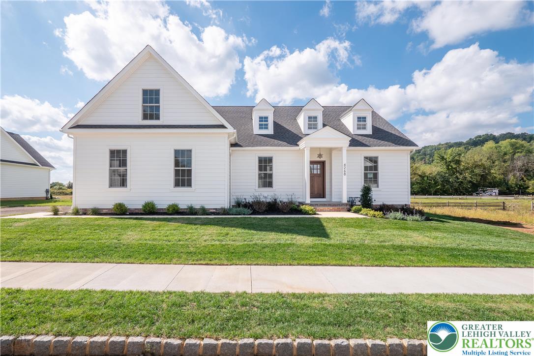 4268 Stonebridge Drive Bethlehem, PA 18015 - Photo 3 of 37 a view of a big house with a big yard and potted plants