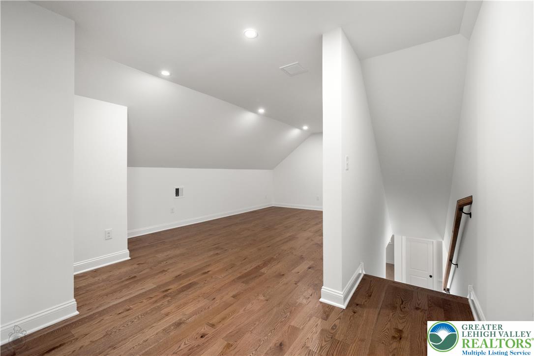 4268 Stonebridge Drive Bethlehem, PA 18015 - Photo 33 of 37 a view of hallway with a window and wooden floor