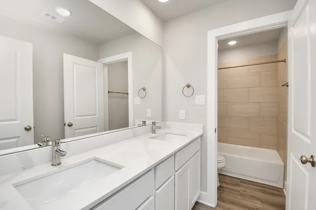 a bathroom with a bathtub and a sink