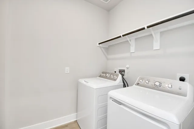 a utility room with dryer and washer