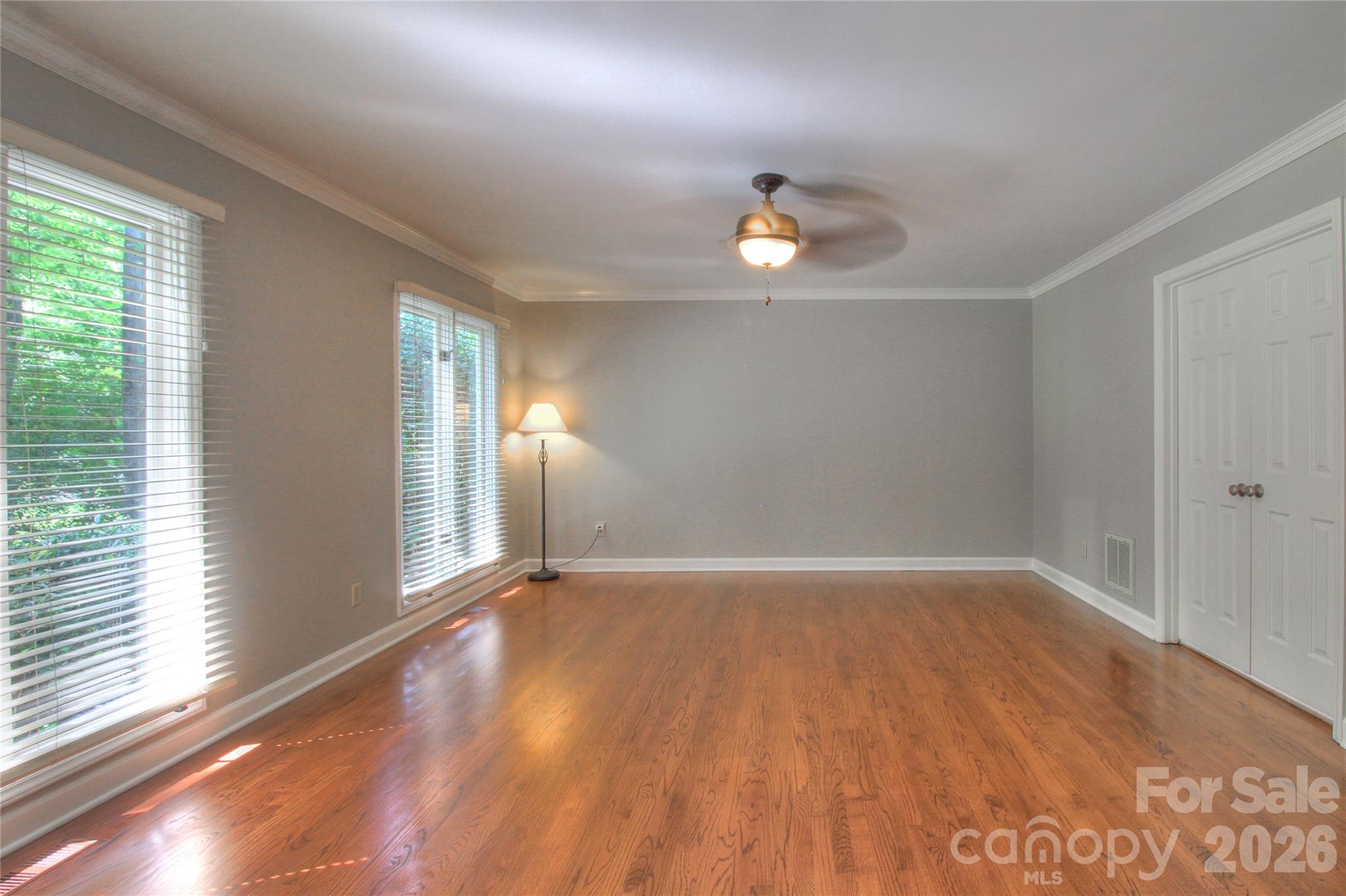 3408 Providence Manor Road Charlotte, NC 28270 - Photo 21 of 39 an empty room with wooden floor and windows