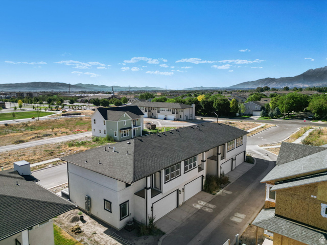 717 South Harrison Drive West Springville, UT 84663 - Photo 28 of 31 Modern multi-unit property featuring a dark shingle roof and white exterior siding