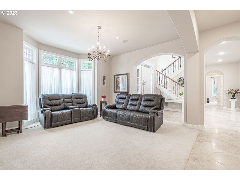 3081 Concomly Road South Salem, OR 97306 - Photo 20 of 47 a living room with furniture and a chandelier