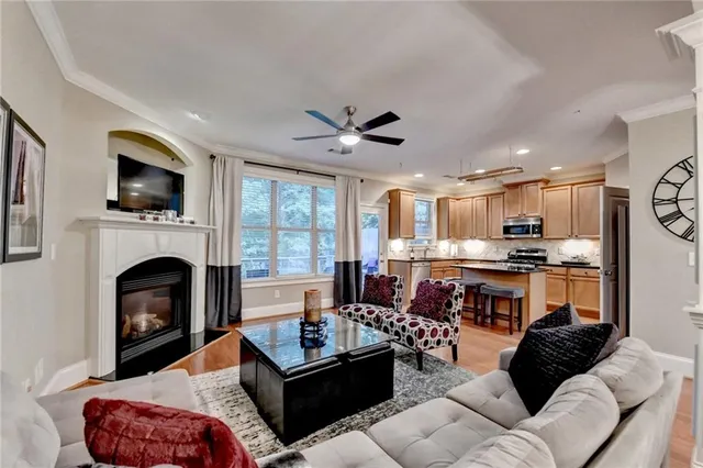 a view of kitchen island with wooden floor and refrigerator