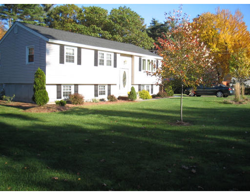 14 Governor Hutchinson Road Billerica, MA 01821 - Photo 1 of 9 a front view of a house with a garden