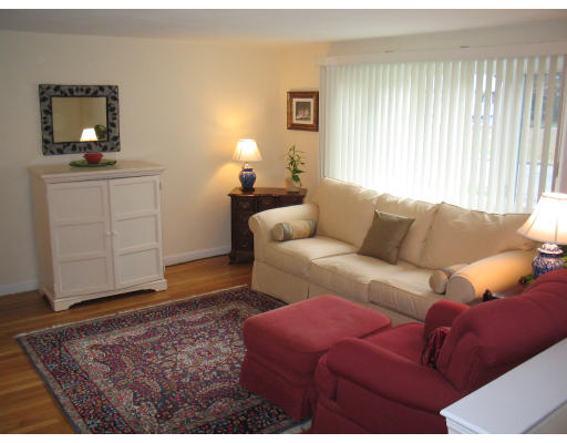 14 Governor Hutchinson Road Billerica, MA 01821 - Photo 5 of 9 a living room with furniture and a rug