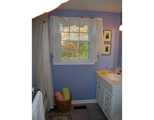 14 Governor Hutchinson Road Billerica, MA 01821 - Photo 6 of 9 a bathroom with a granite countertop sink and a bathtub