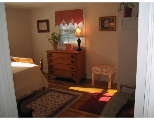 14 Governor Hutchinson Road Billerica, MA 01821 - Photo 8 of 9 a bed room with a bed and a mirror