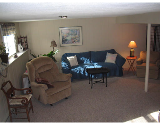 14 Governor Hutchinson Road Billerica, MA 01821 - Photo 9 of 9 a living room with furniture and wooden floor