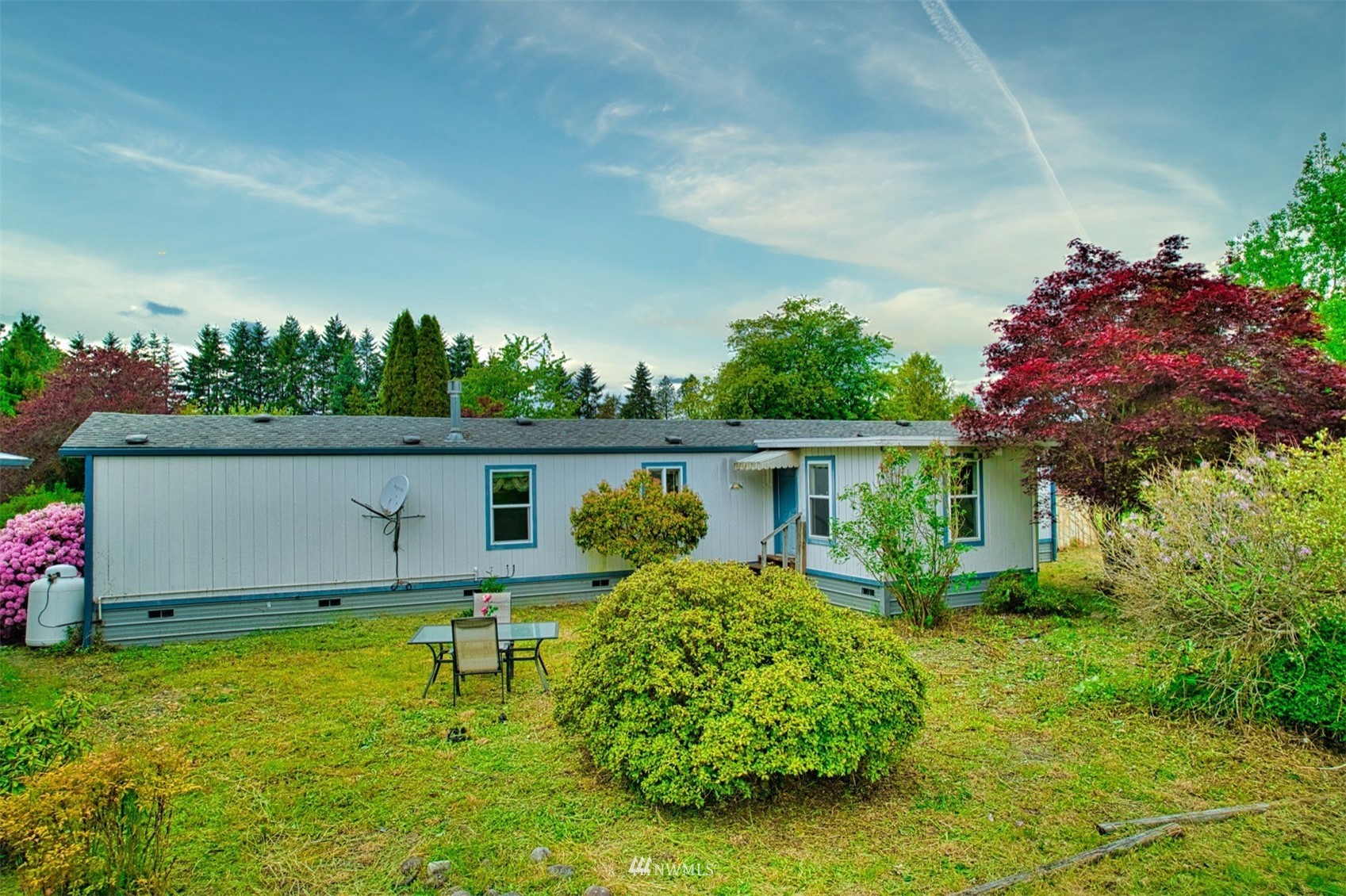 7240 183rd Avenue Southwest Rochester, WA 98579 - Photo 9 of 35 a front view of a house with garden
