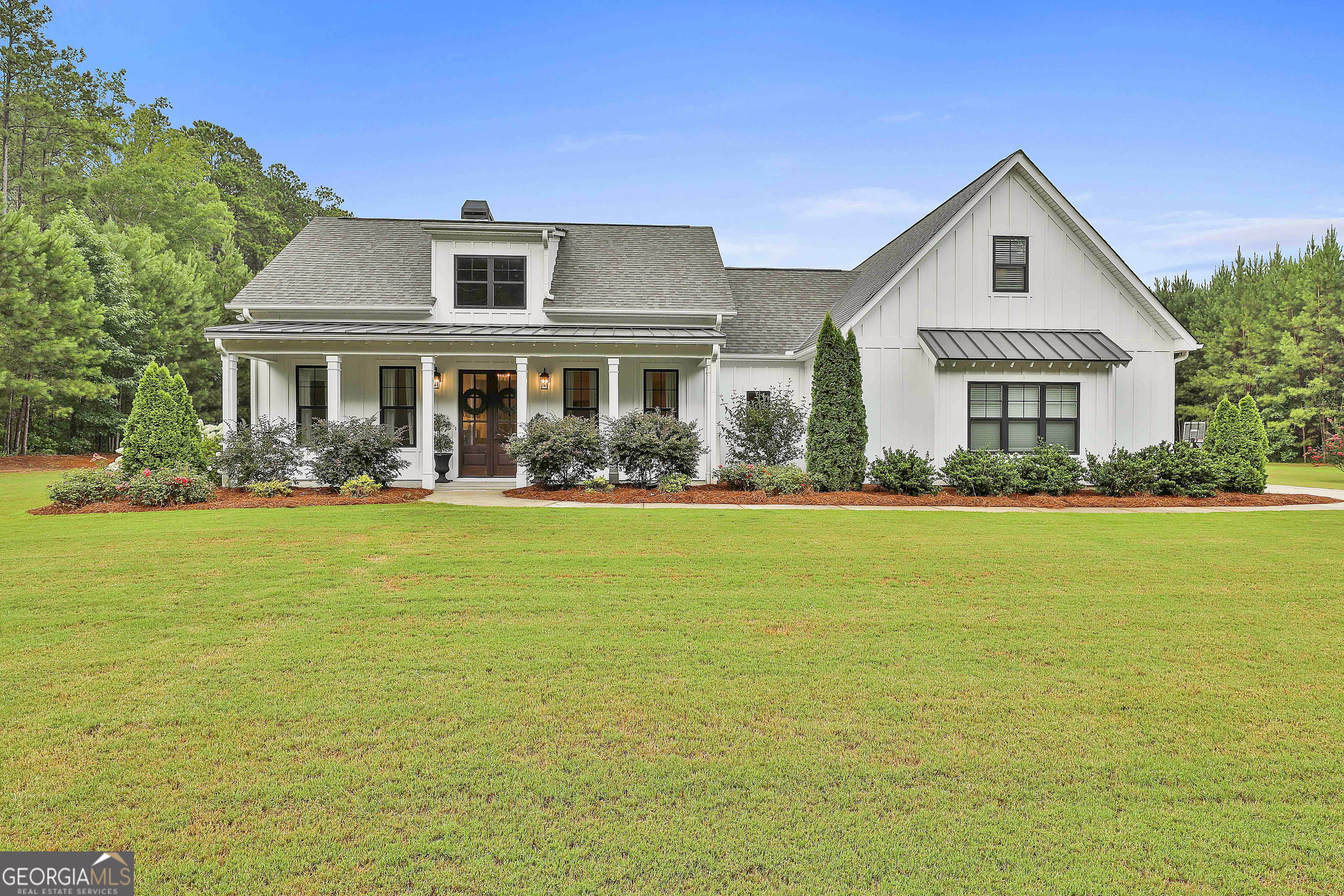 a front view of house with yard and green space